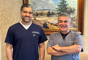 Doctor Saber and Doctor Bagga smiling in Cranford periodontal office