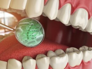 a magnifying glass looking in a mouth at oral bacteria